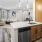 a kitchen with wood cabinets and stainless steel appliances