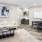 a living room with a couch coffee table and table with chairs
