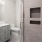 a bathroom with a toilet sink and shower