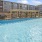 a pool with a building in the background