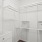 a white shelving unit and a white cabinet
