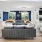 a lounge with a large couch chairs fireplace and tv