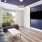 a room with a tv and windows