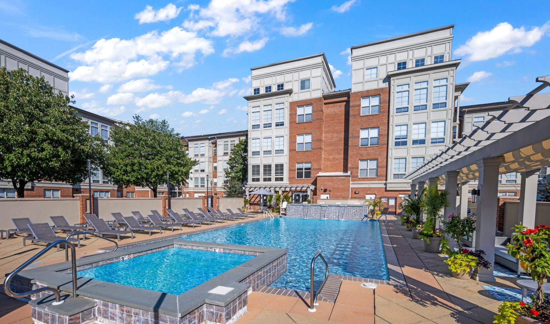 Relax and unwind poolside a swimming pool in a courtyard