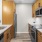 a kitchen with wooden cabinets and stainless steel appliances