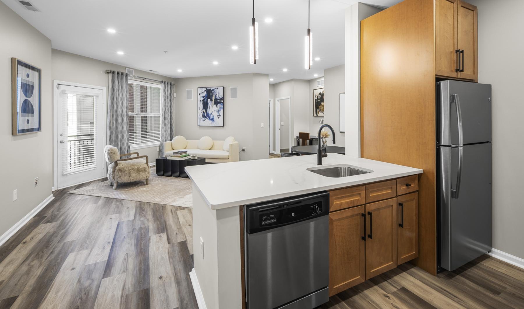 a kitchen with wood cabinets and stainless steel appliances