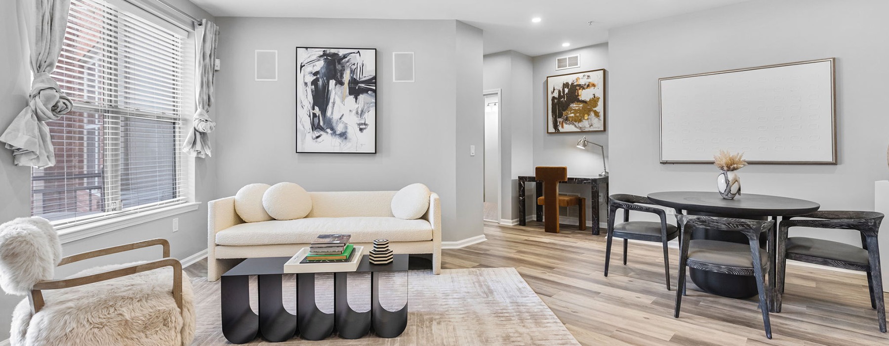 living room with furniture tables and windows