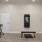 a room with a tv bench and exercise equipment