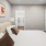 a bedroom with a bed and a lamp