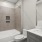 a bathroom with a tub sink and toilet