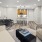 a living room with a  couch table and chairs